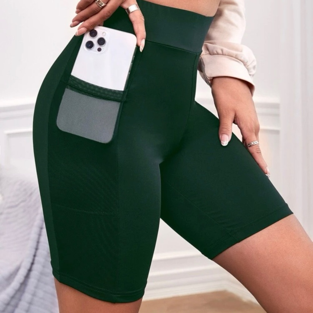 Unworn SHEIN biker shorts with mesh pockets.